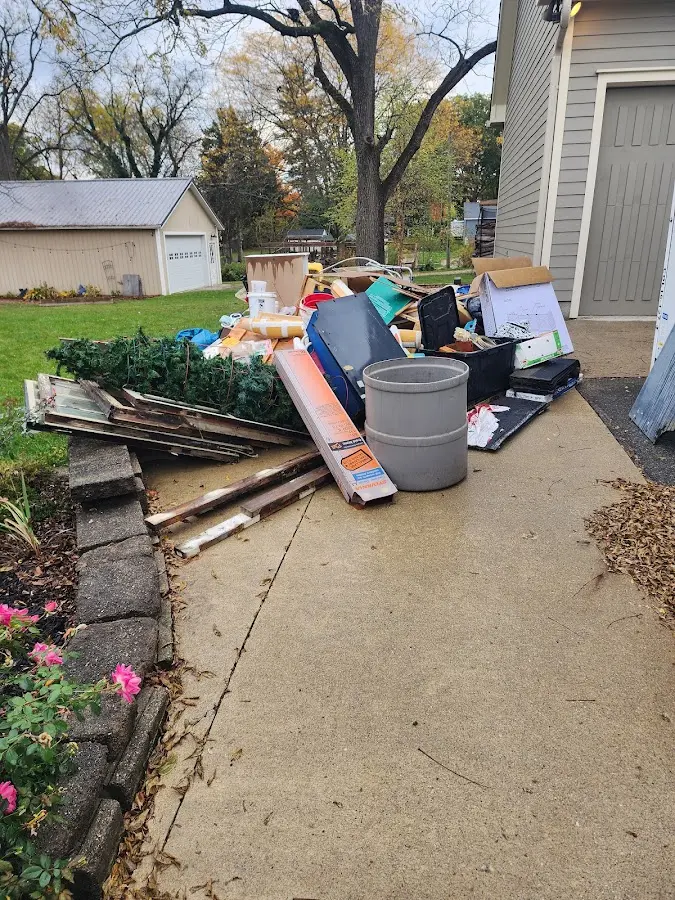 Dumpster being loaded with debris for 30 Yard Dumpster Rental in Kokomo